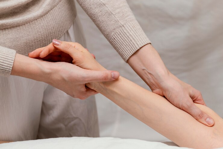 close-up-therapist-massaging-patient-s-arm_23-2148882180.jpg