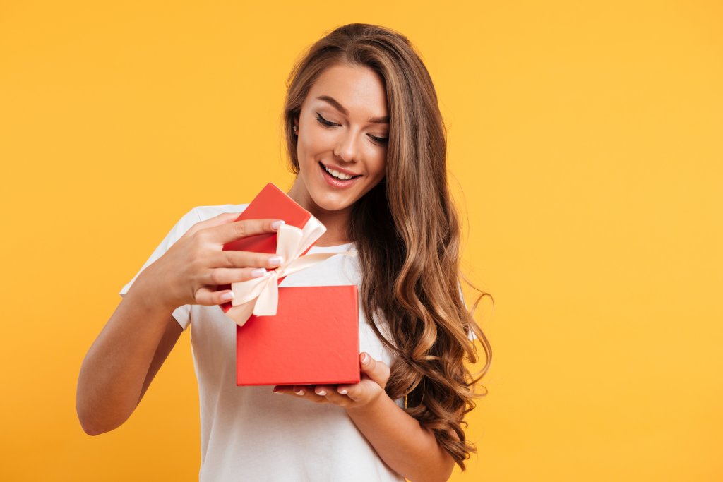 portrait-of-a-happy-smiling-girl-opening-gift-box.jpg