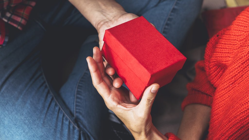 man-giving-small-gift-box-to-woman.jpg